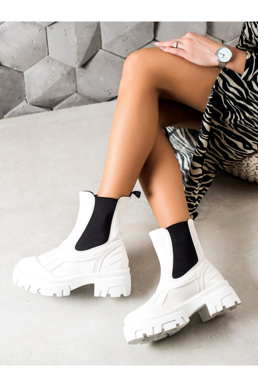 White color Women's boots with black rubber