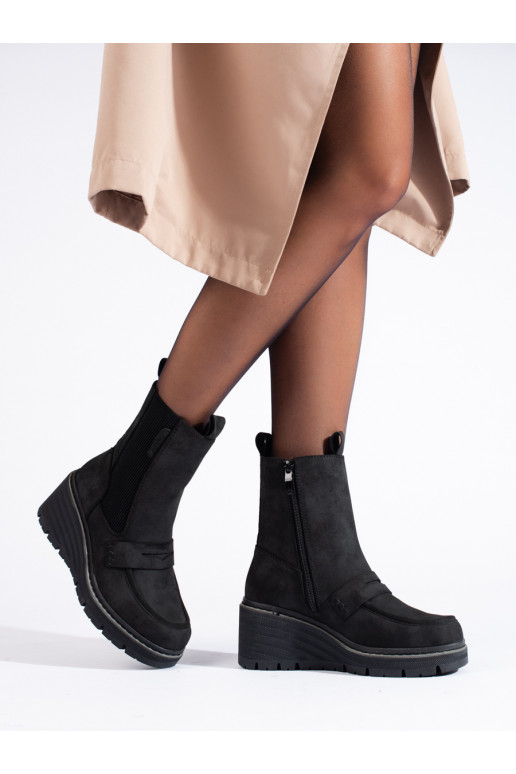 black Chelsea boots of suede boots on a wedge