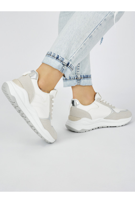 White color womens sneakers on a thick sole