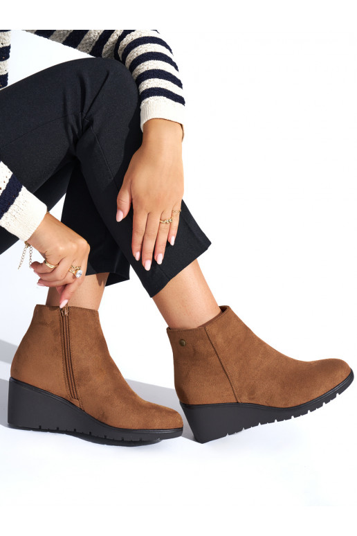 Brown color boots on a wedge