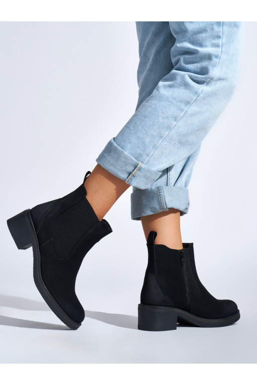 black women's boots on a low post