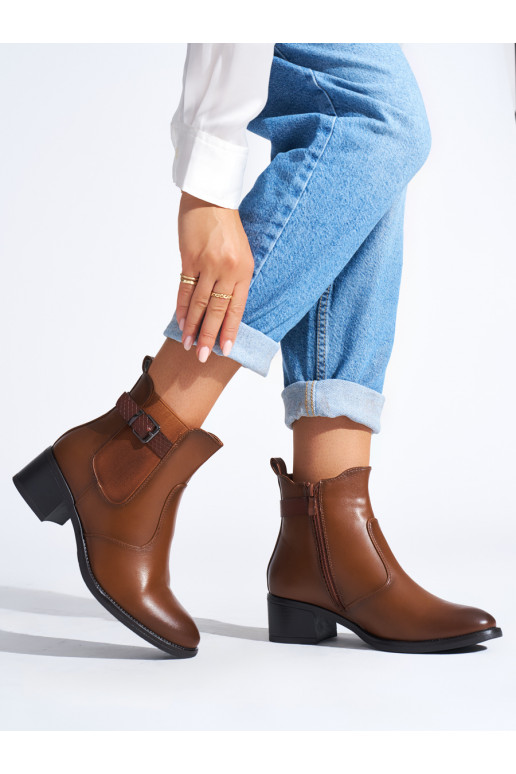 Brown color women's boots on a low post