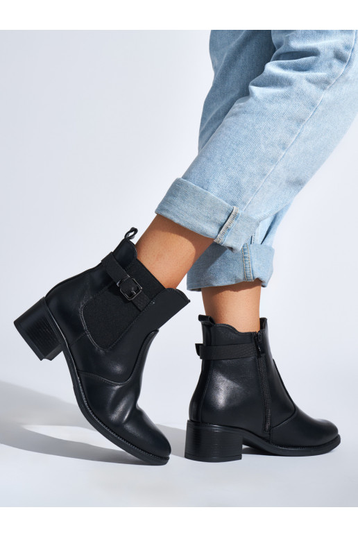 black women's boots on a low post