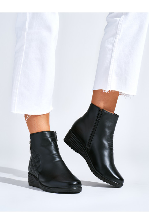 Comfortable black boots on a wedge