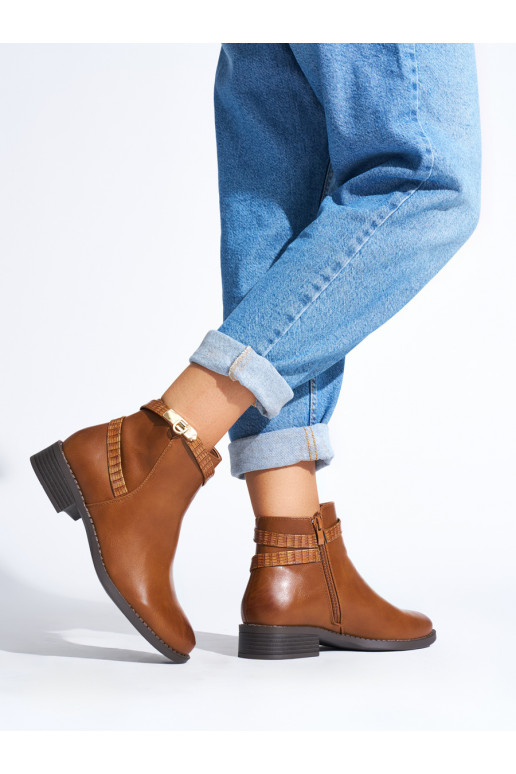 Brown color women's boots on a low heel