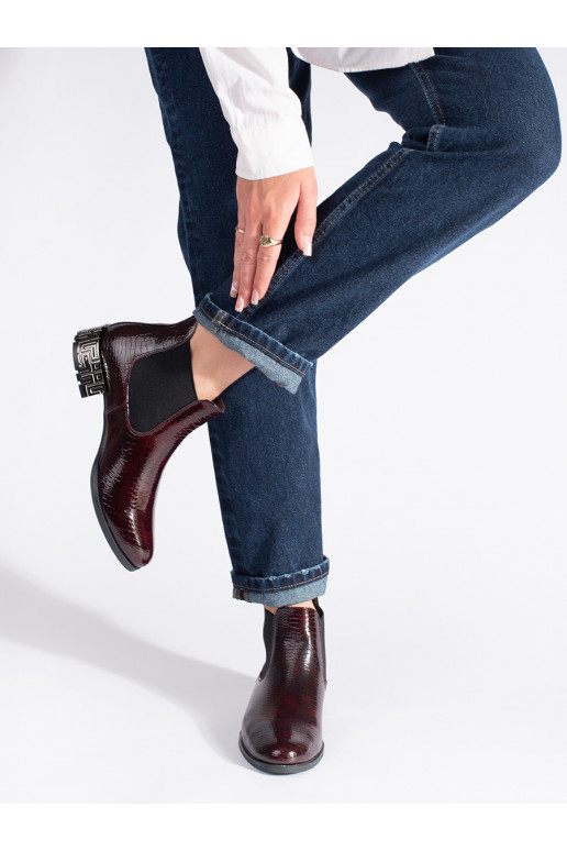 burgundy Chelsea boots with a decorative heel