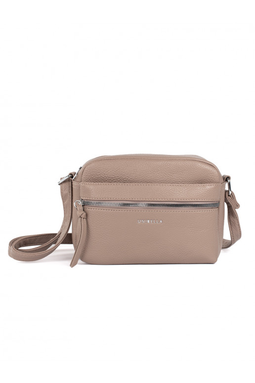 Small beige elegant handbag on shoulder