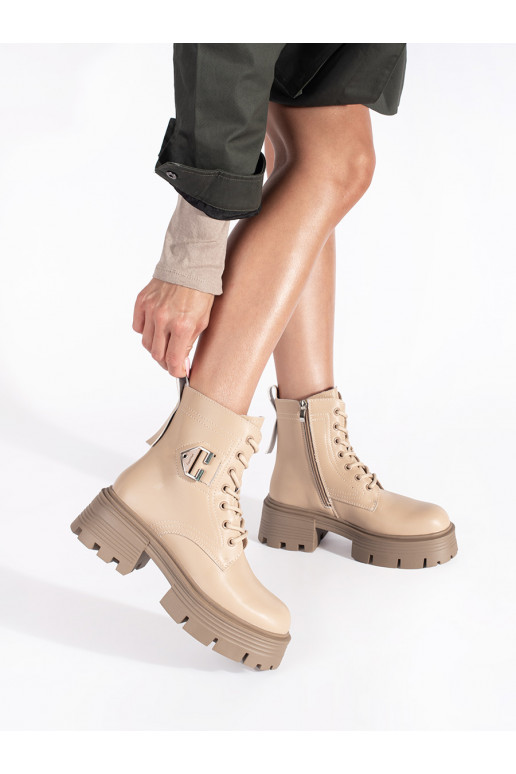 Leather beige boots on a thick sole