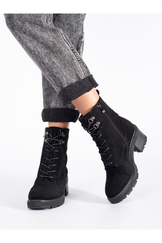 black of suede boots tied on the heel