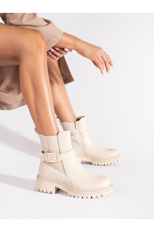 cream colors classic boots with a decorative stripe