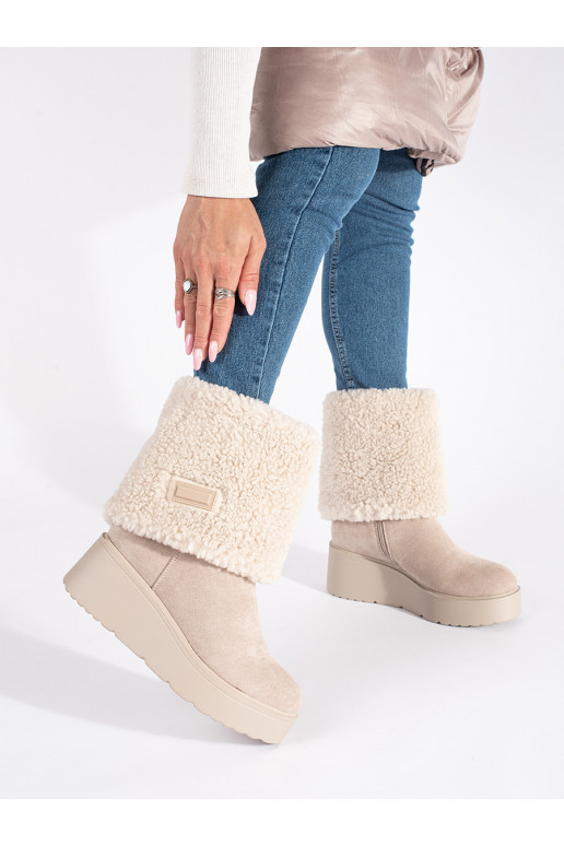 beige insulated women's boots on a wedge