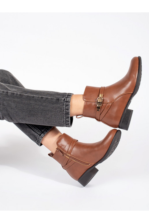 Brown color women's boots on a low heel with a decorative stripe