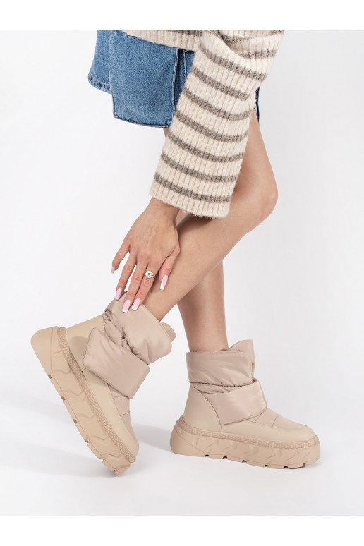 beige insulated Women's snow boots on a thick sole