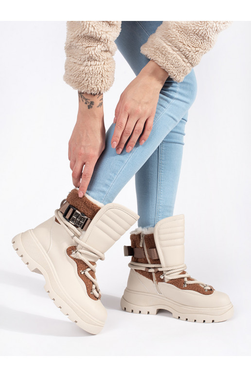 beige Women's snow boots with fur on a thick sole