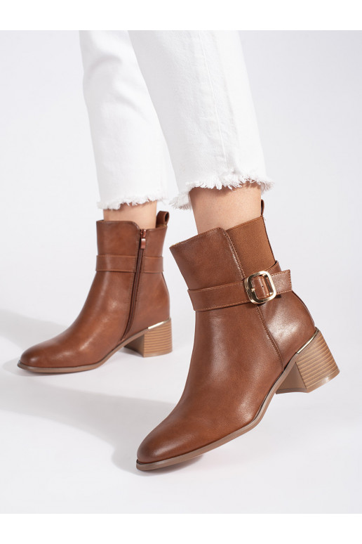 Brown color women's boots on the heel with buckles