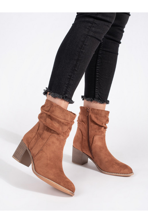 Brown color of suede ankle boots with a ruffled upper