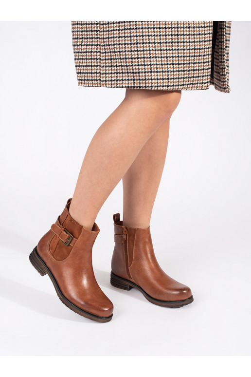 Brown color women's boots with buckles on a low heel