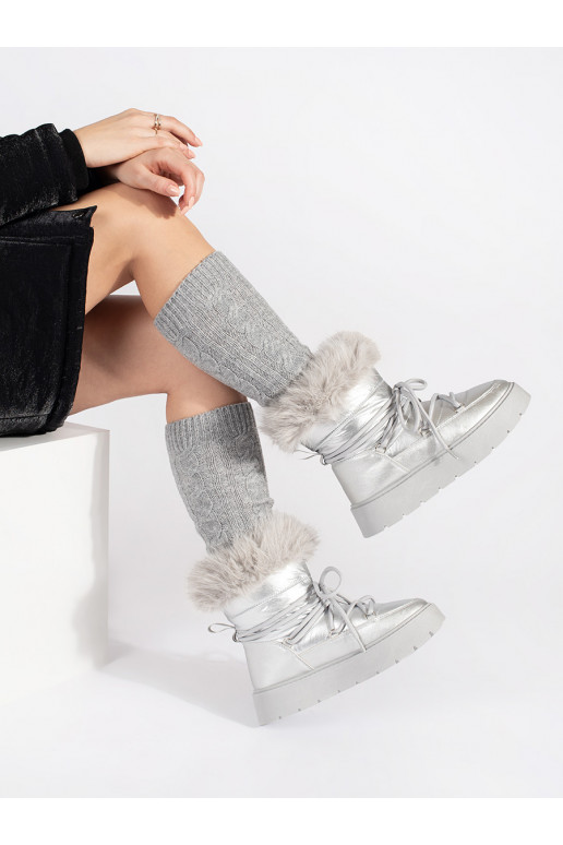 silver color Women's snow boots with fur on a thick sole