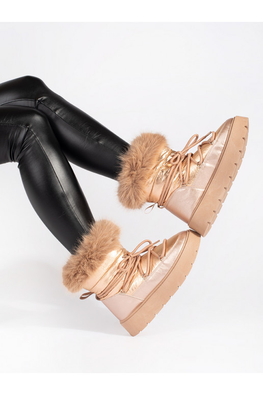 gold color Women's snow boots with fur on a thick sole