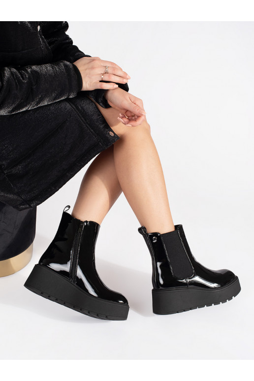 black lacquered Women's boots on a wedge