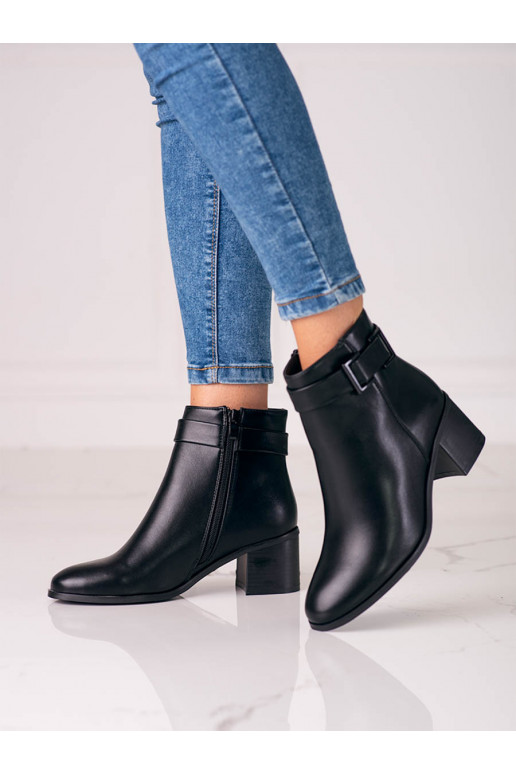 The classic model black women's boots on a low post