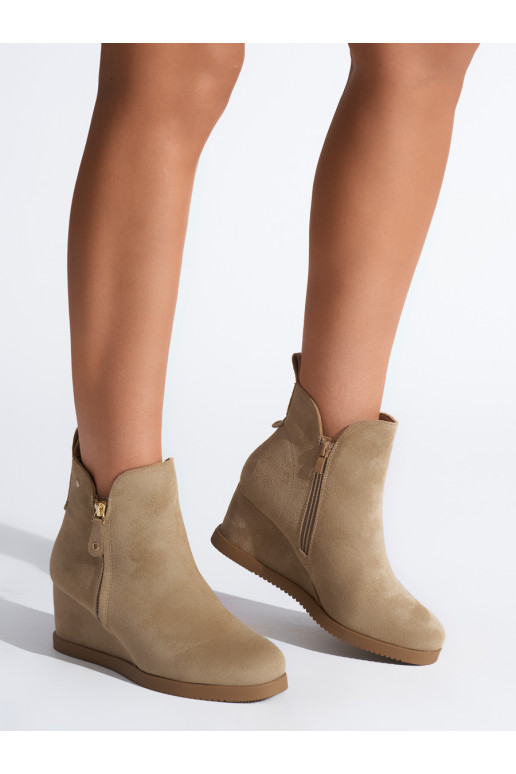 beige women's boots on a wedge