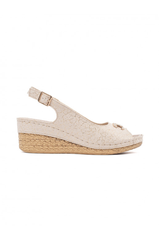 beige sandals on a wedge with buckle